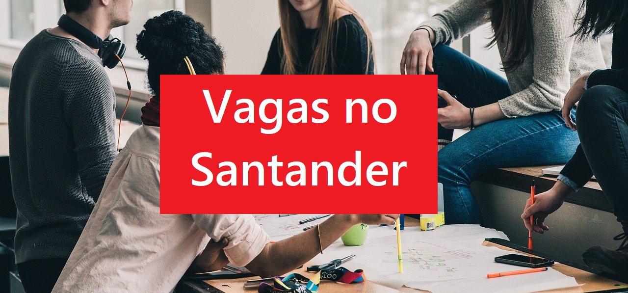 Santander vagas trainee: Letreiro escrito vagas no Santander e pessoas trabalhando ao fundo